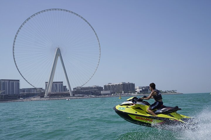 Experience the stunning JBR skyline and the iconic Dubai Eye from the sea on a jet ski. Feel the rush of the breeze as you navigate the beautiful waters of Dubai.